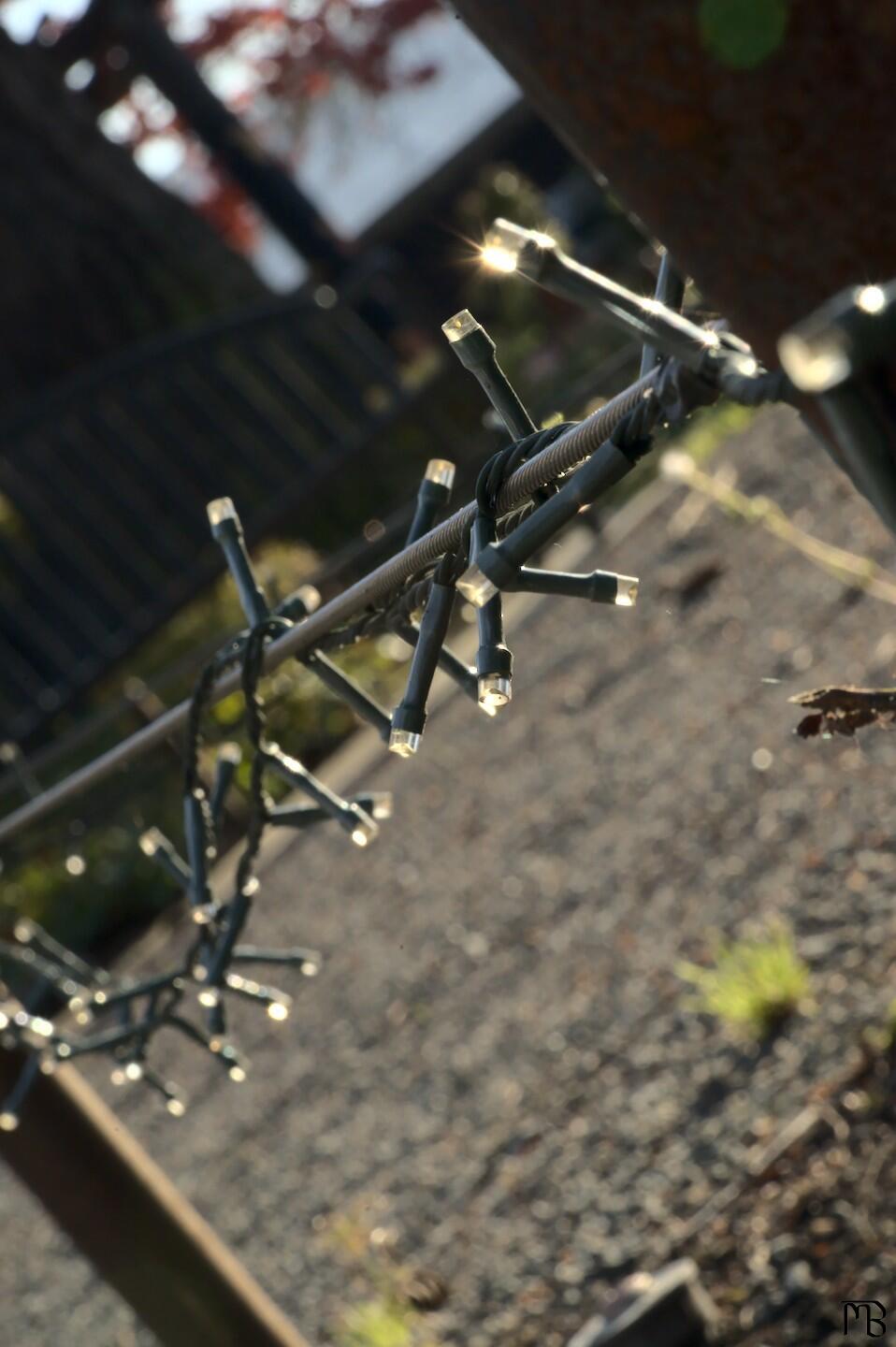 Lights on a rail in the sun