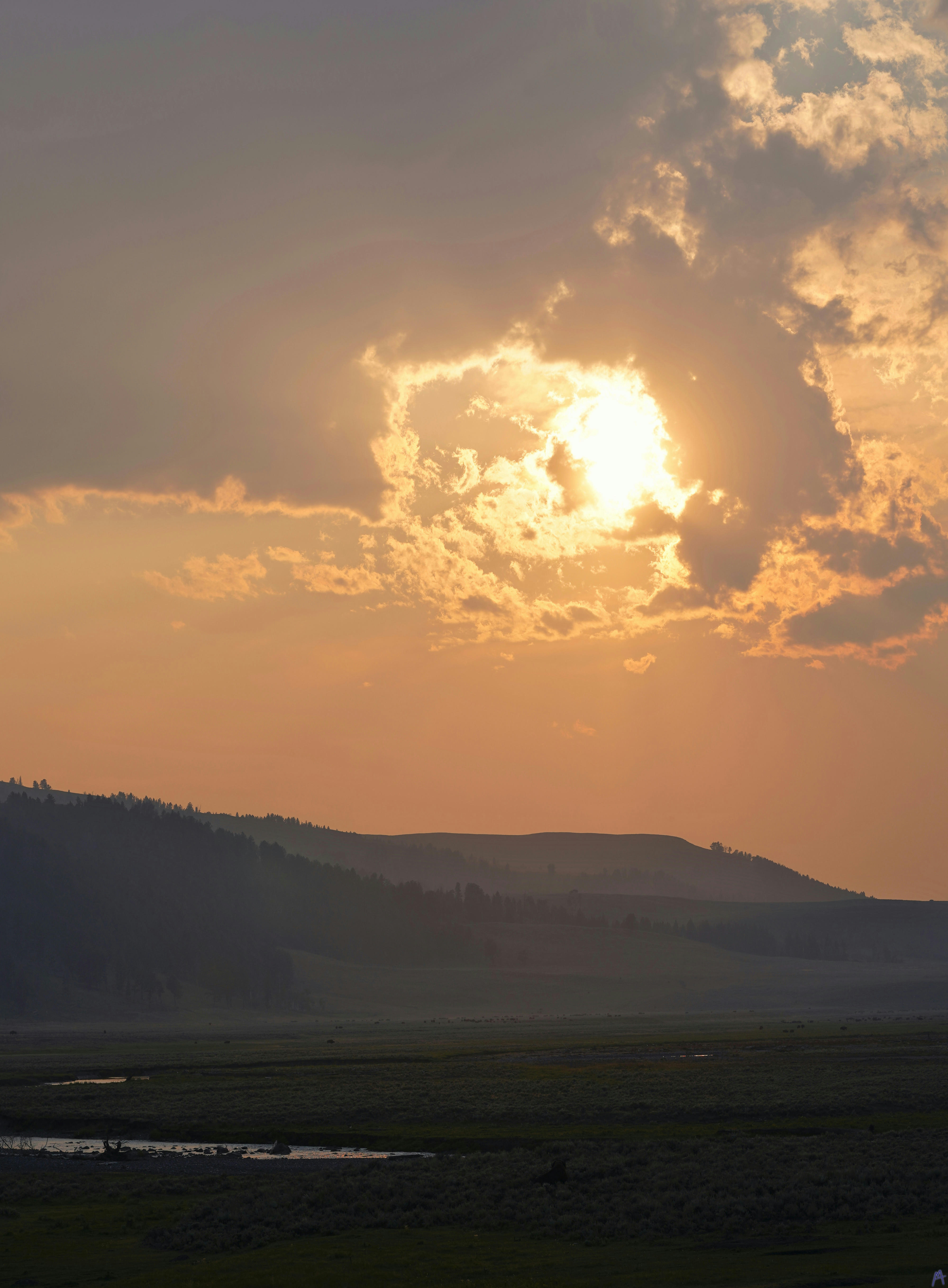 Blooming orange sunset in clouds at Yellowstone