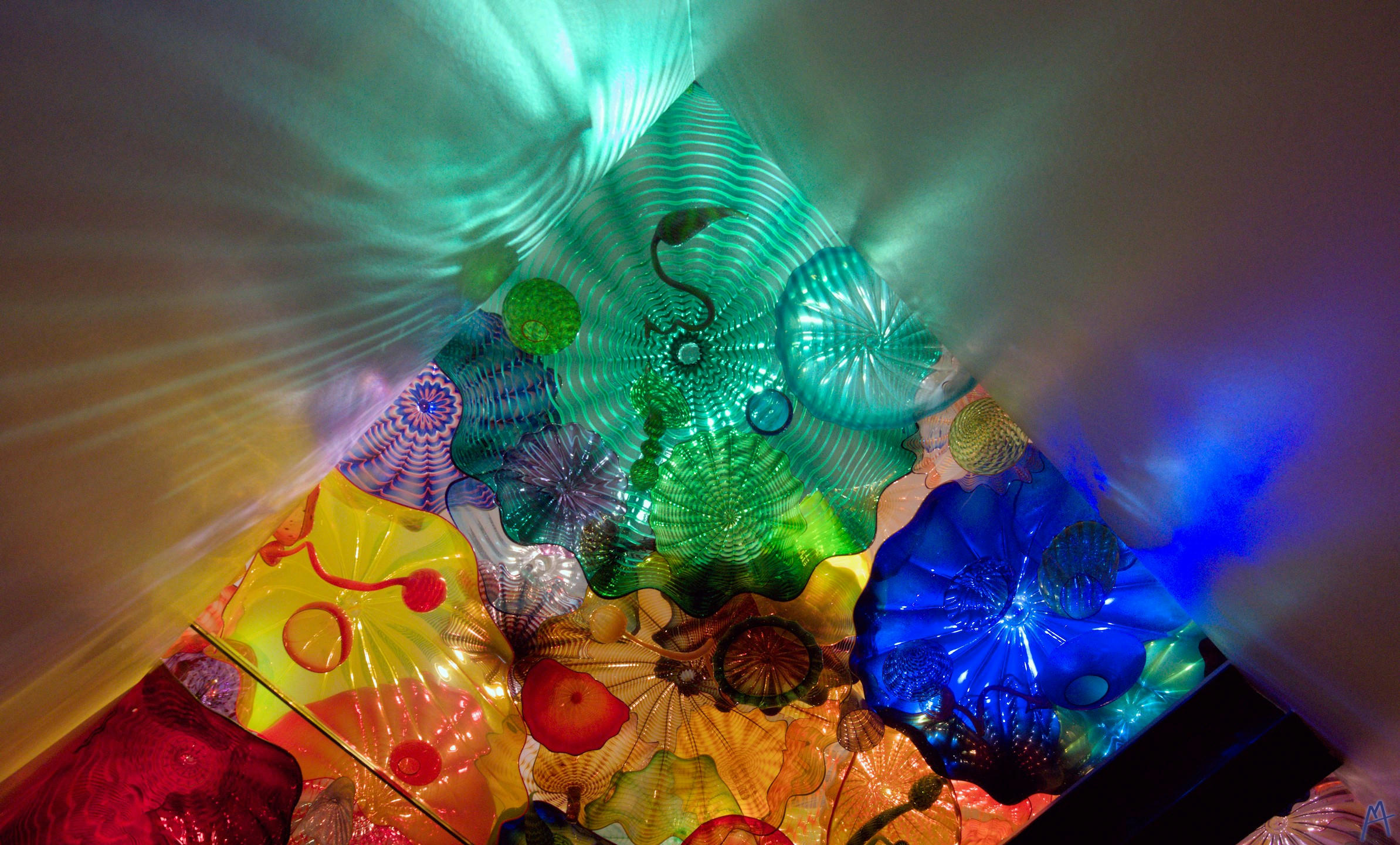 Green blue yellow and red glass sea shells in the ceiling
