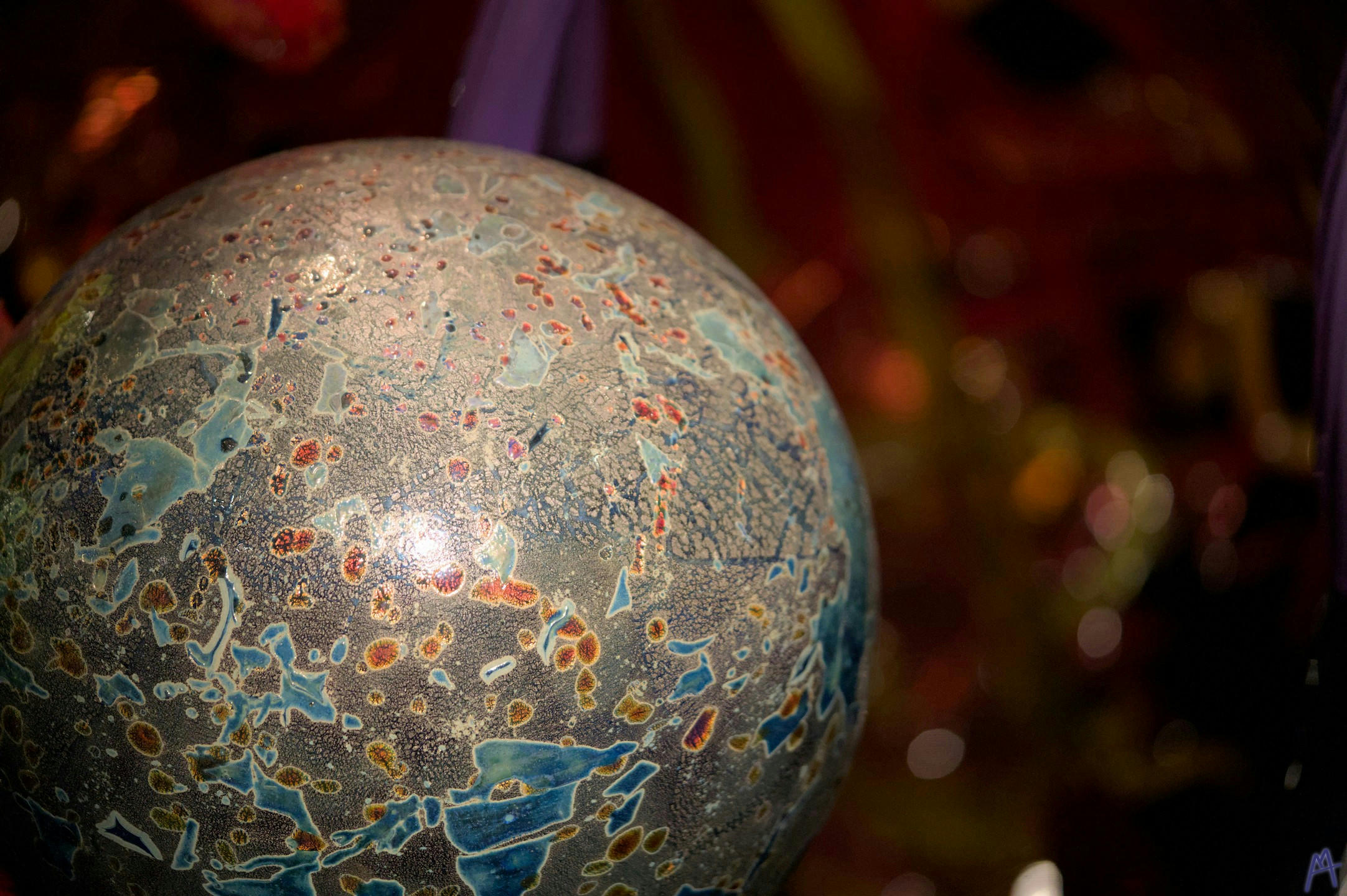 Stone and blue glass sphere closeup